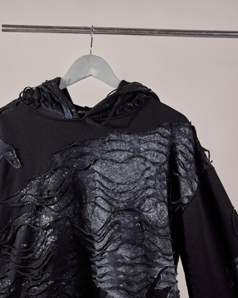 Side shoulder view of Awake oversized hoodie on hanger – Volfsbane raw streetwear India

