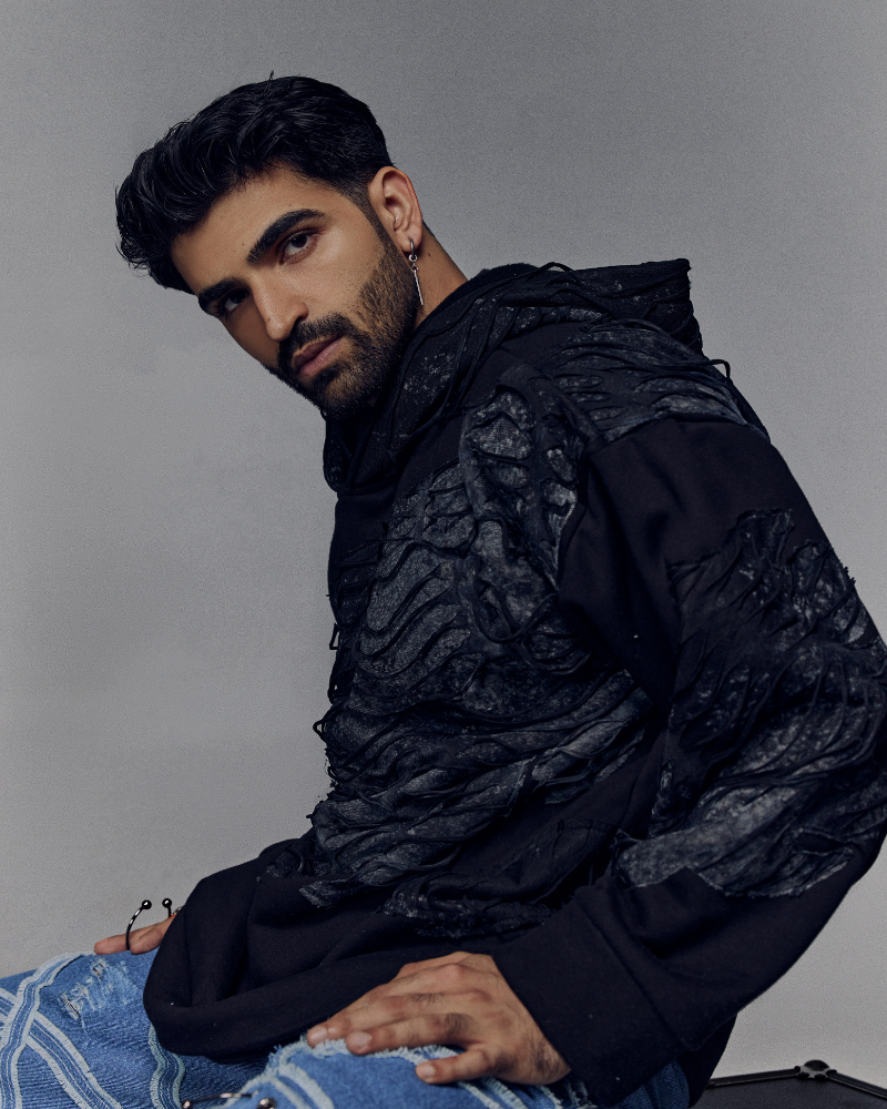 Male model wearing front view of Awake oversized hoodie – Volfsbane streetwear for men in India
