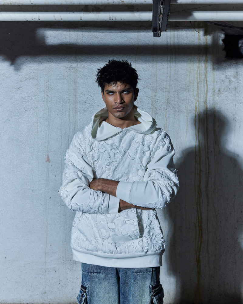 Male model wearing front view of Bite Me oversized hoodie – Volfsbane streetwear India.