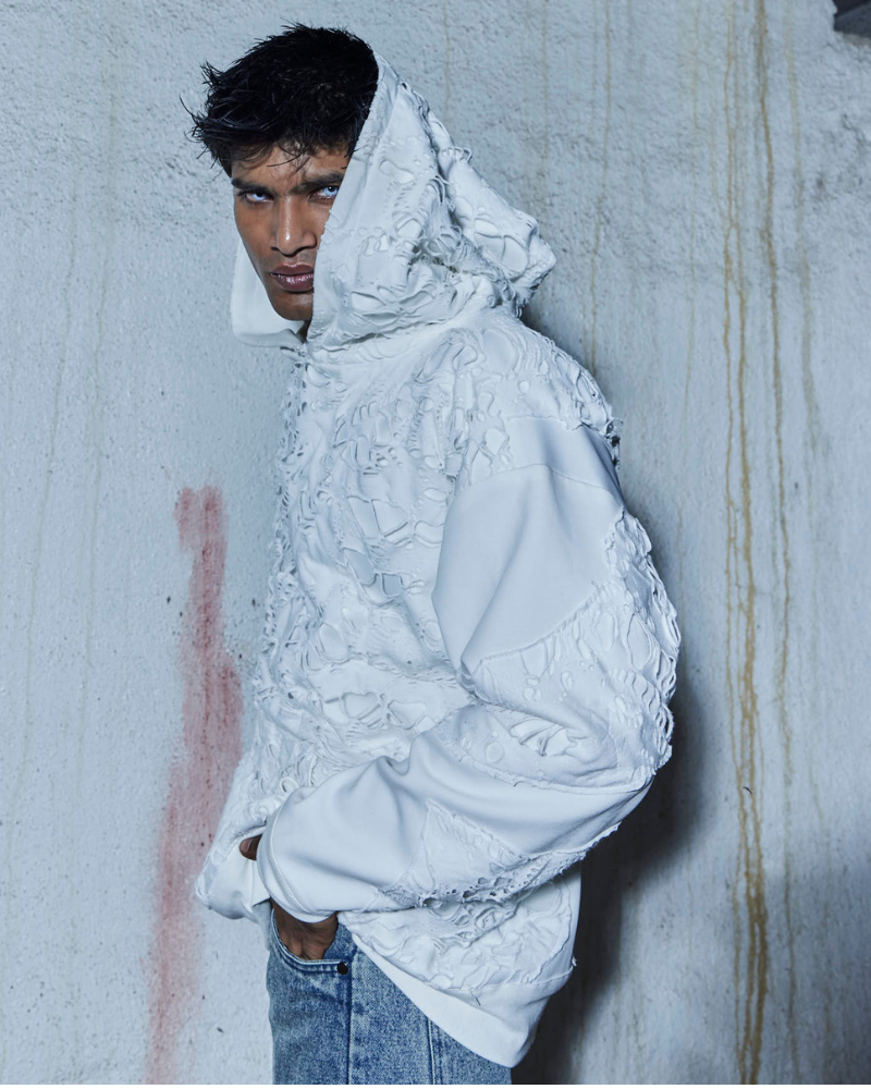 Side pose of male model in Bite Me oversized hoodie – Volfsbane streetwear for men
