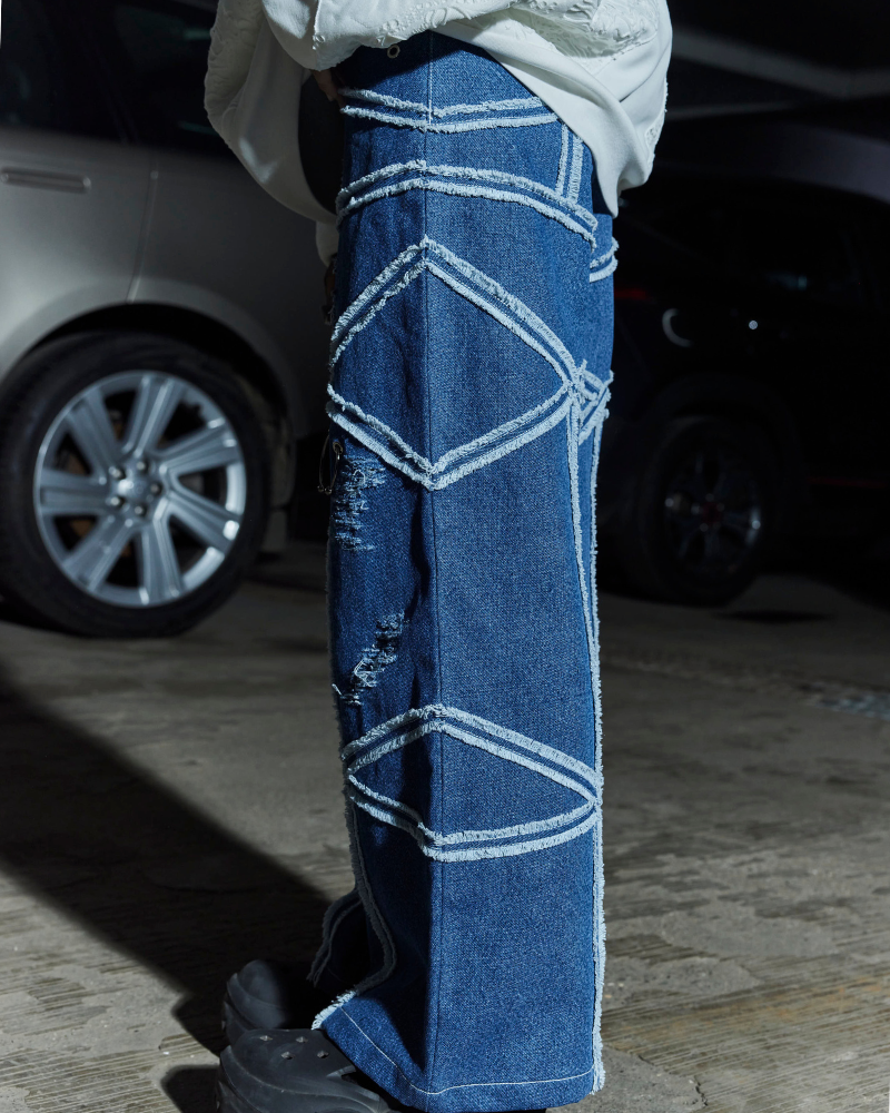 Left view of female model wearing Criss oversized denim pants – Volfsbane streetwear India
