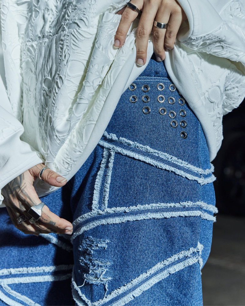 Side view of female model in Criss oversized denim pants – Volfsbane streetwear for women India
