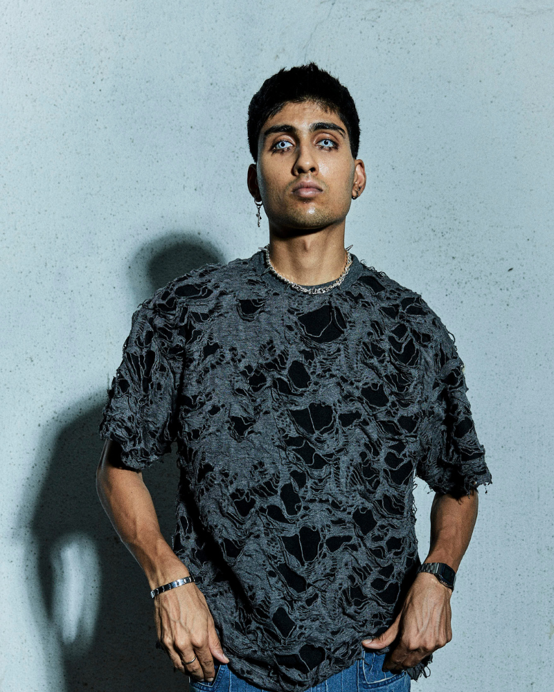 Male model wearing grey Torn oversized T-shirt front view – Volfsbane grunge streetwear India
