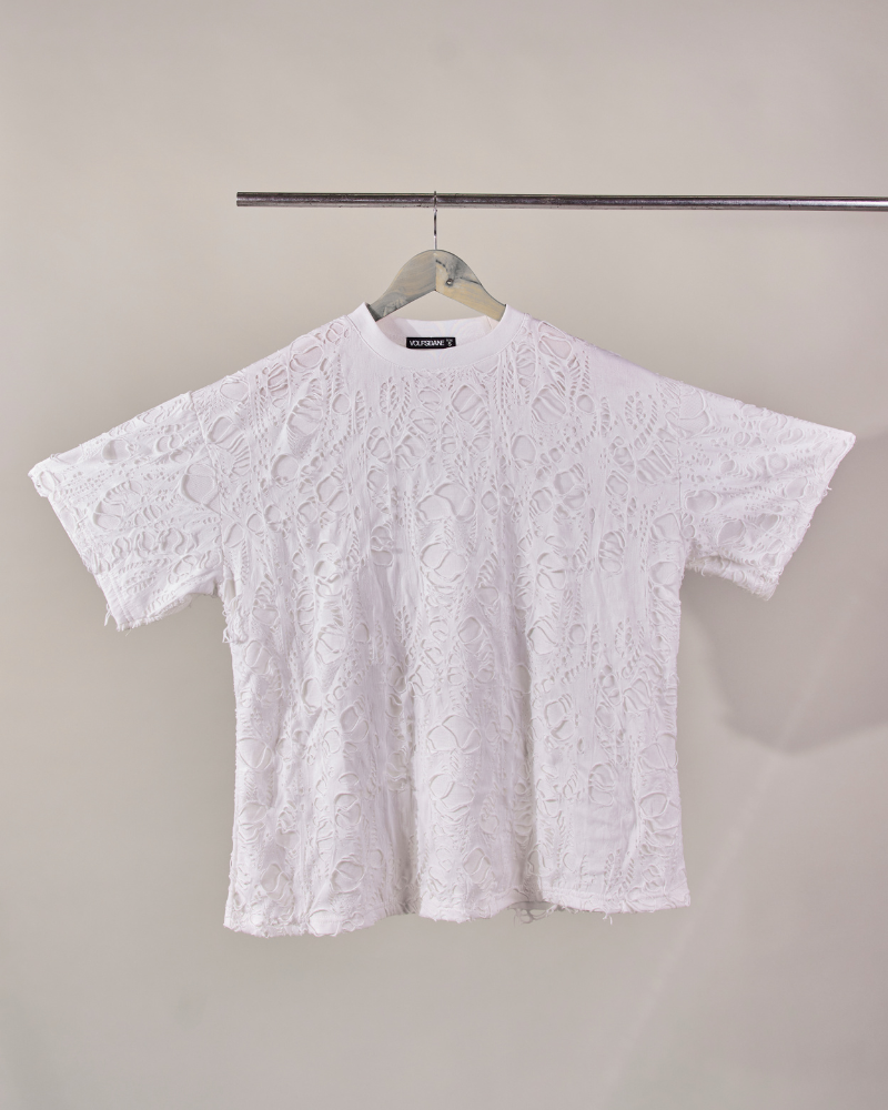 Front view of white Torn oversized T-shirt with ripped design – Volfsbane streetwear India
